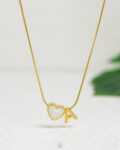 thin white heart letter A necklace