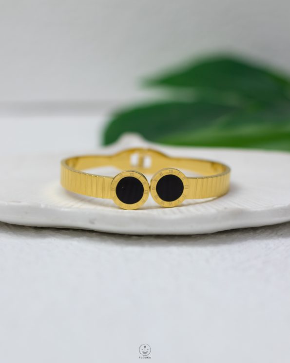 black bulgari gold bracelet
